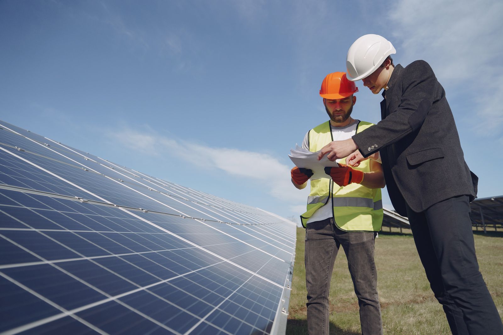 A Brightpath technician checking module output on a roof in Fresno